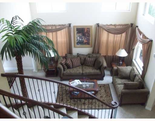 sweeping staircase overlooking living room