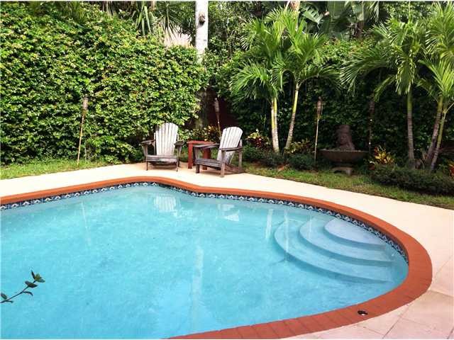 lushly landscaped pool area